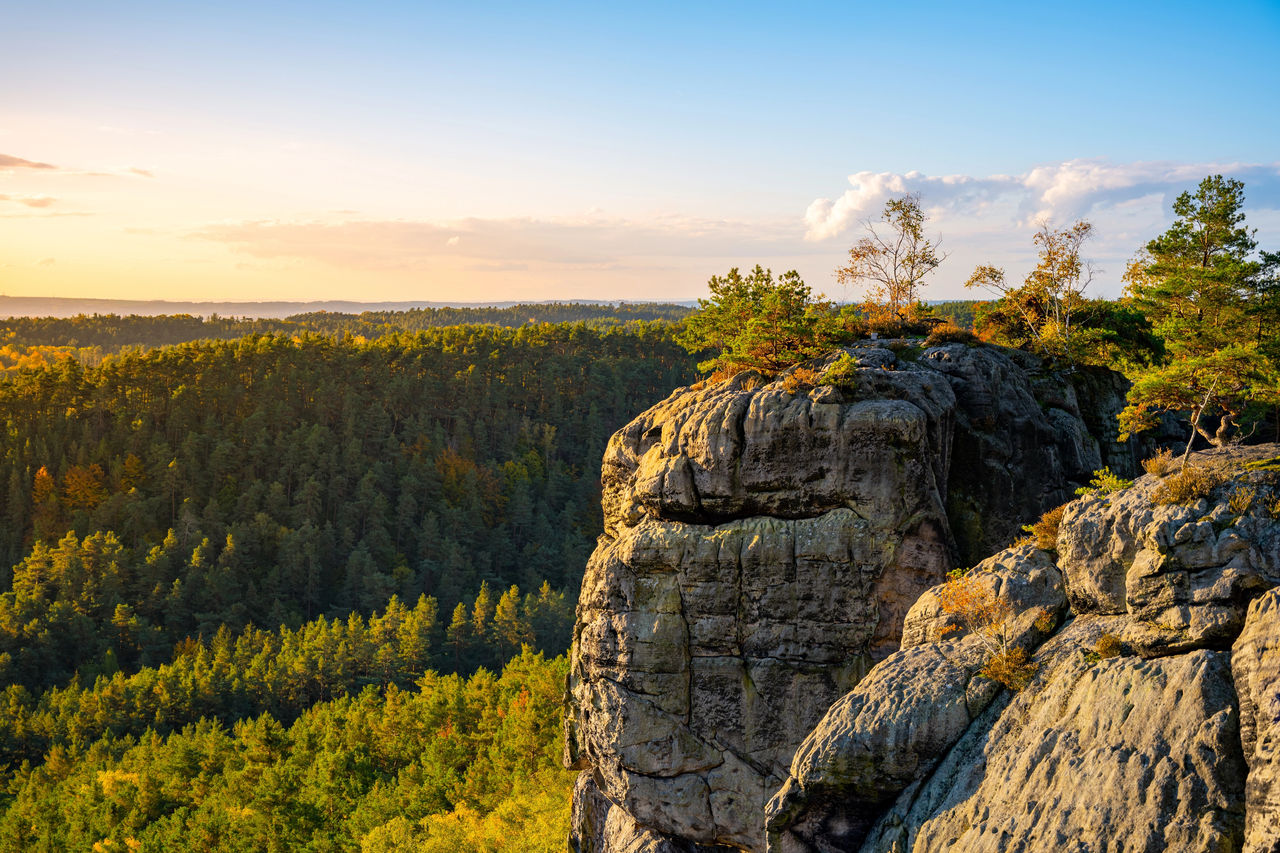 Sunset in Bohemian Paradise. Aerial view from Drabske svetnicky castle ruins. With Bezdez Mountain and Castle silhouette on background. Czech Republic