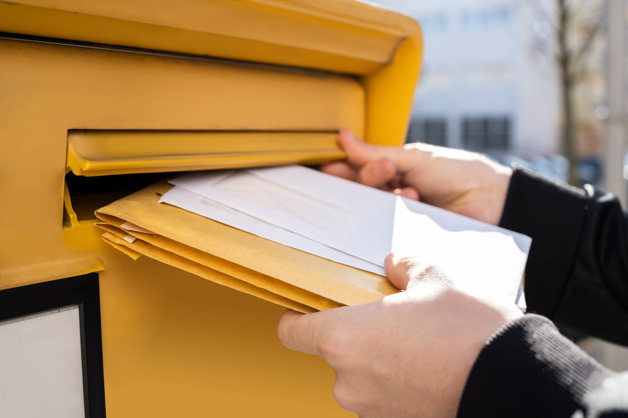 Letter In Envelope Or Document In Mailbox. Man Hand Sending Mail